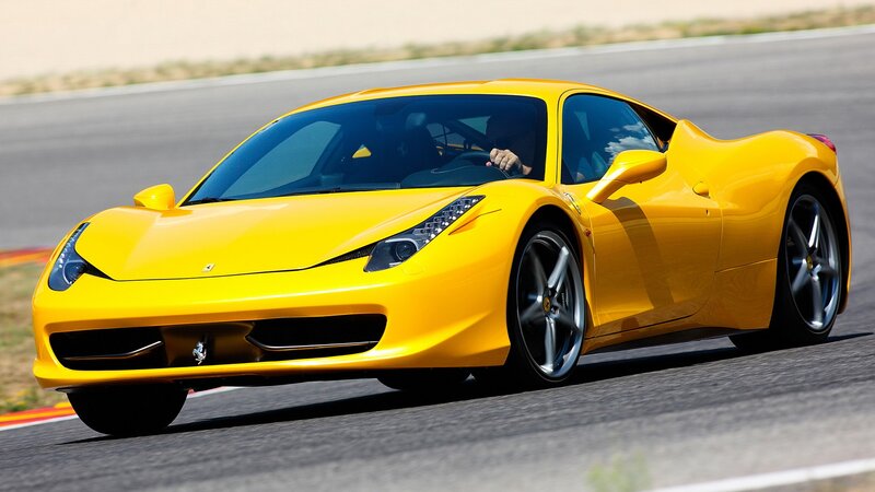 Yellow Ferrari on a racetrack