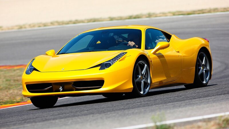 Yellow Ferrari on a racetrack