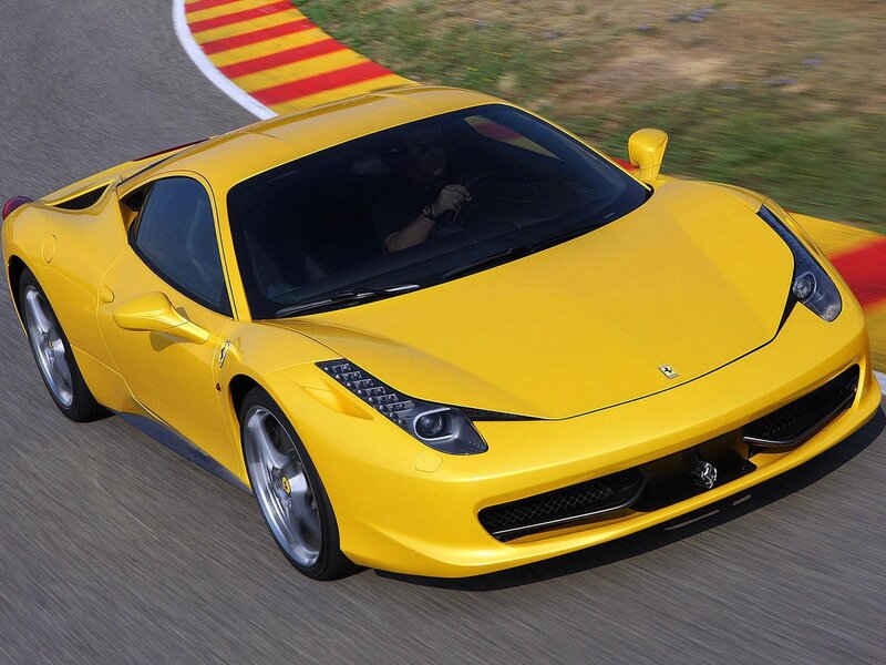 Yellow Ferrari on a racetrack