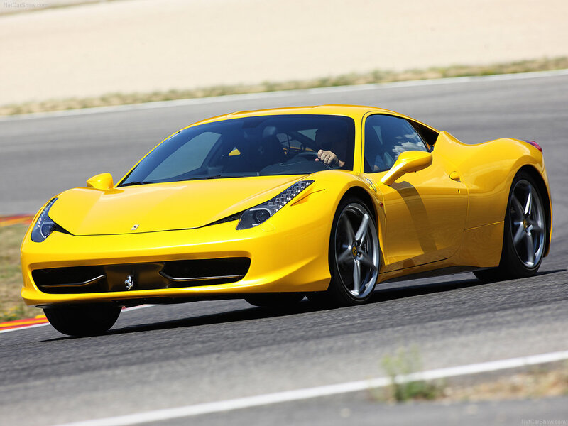 Yellow Ferrari on a racetrack