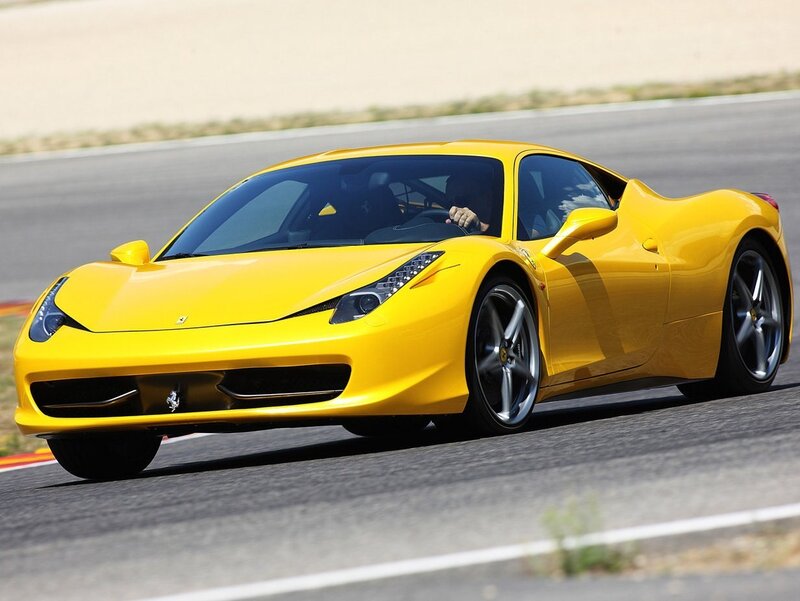 Yellow Ferrari on a racetrack