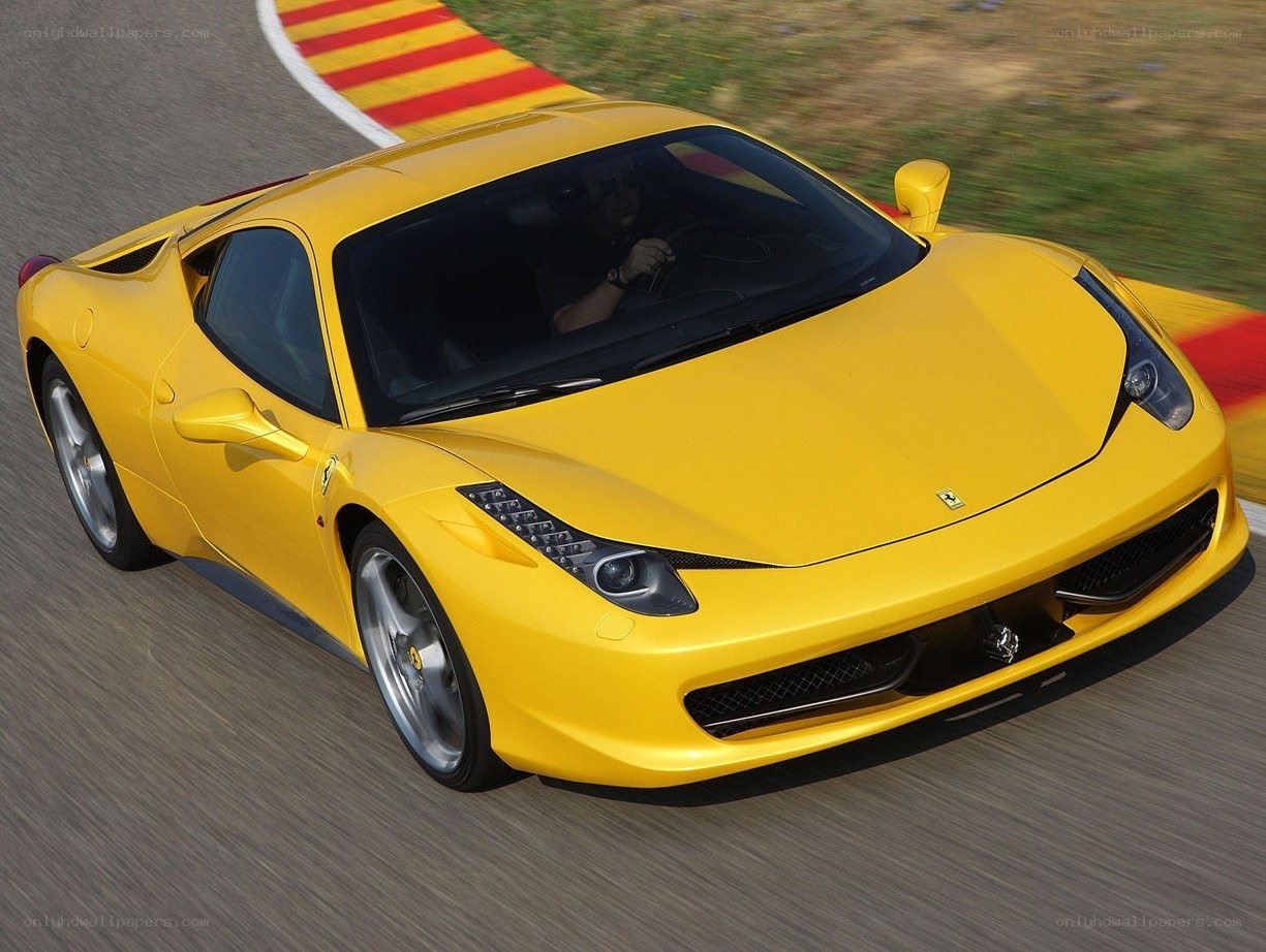Yellow Ferrari on a racetrack