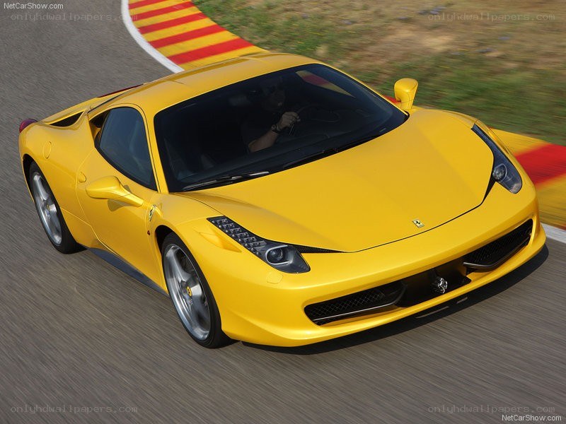 Yellow Ferrari on a racetrack