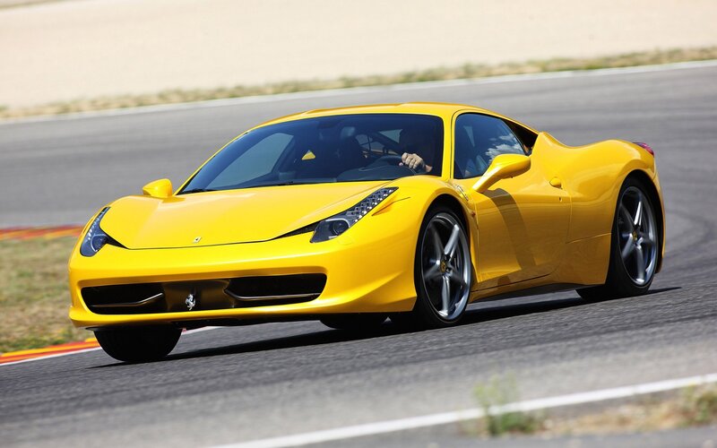 Yellow Ferrari on a racetrack