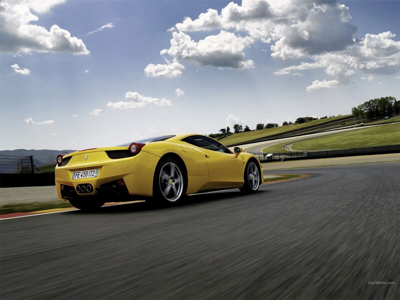 Yellow Ferrari on a racetrack