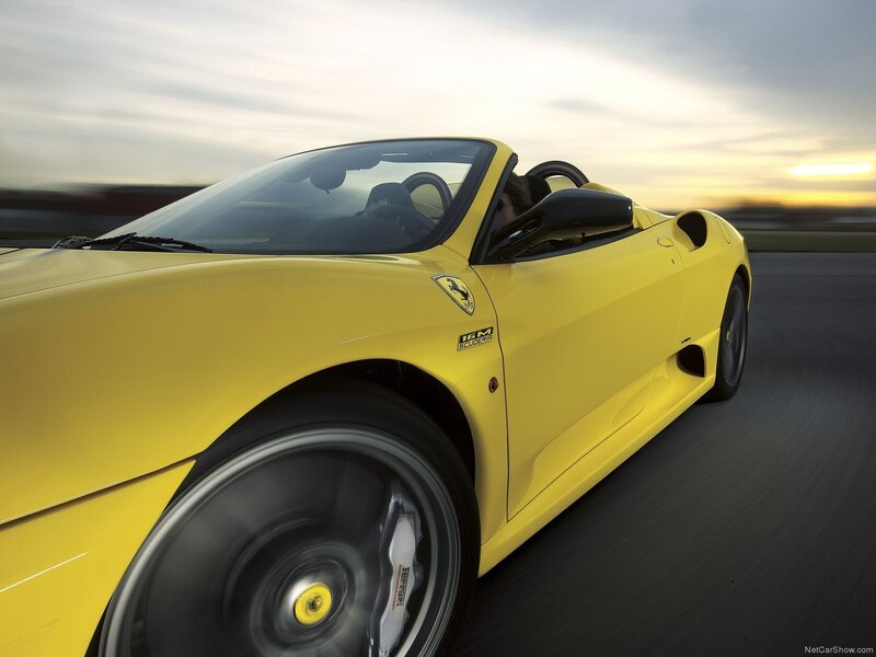 Yellow Ferrari on a racetrack