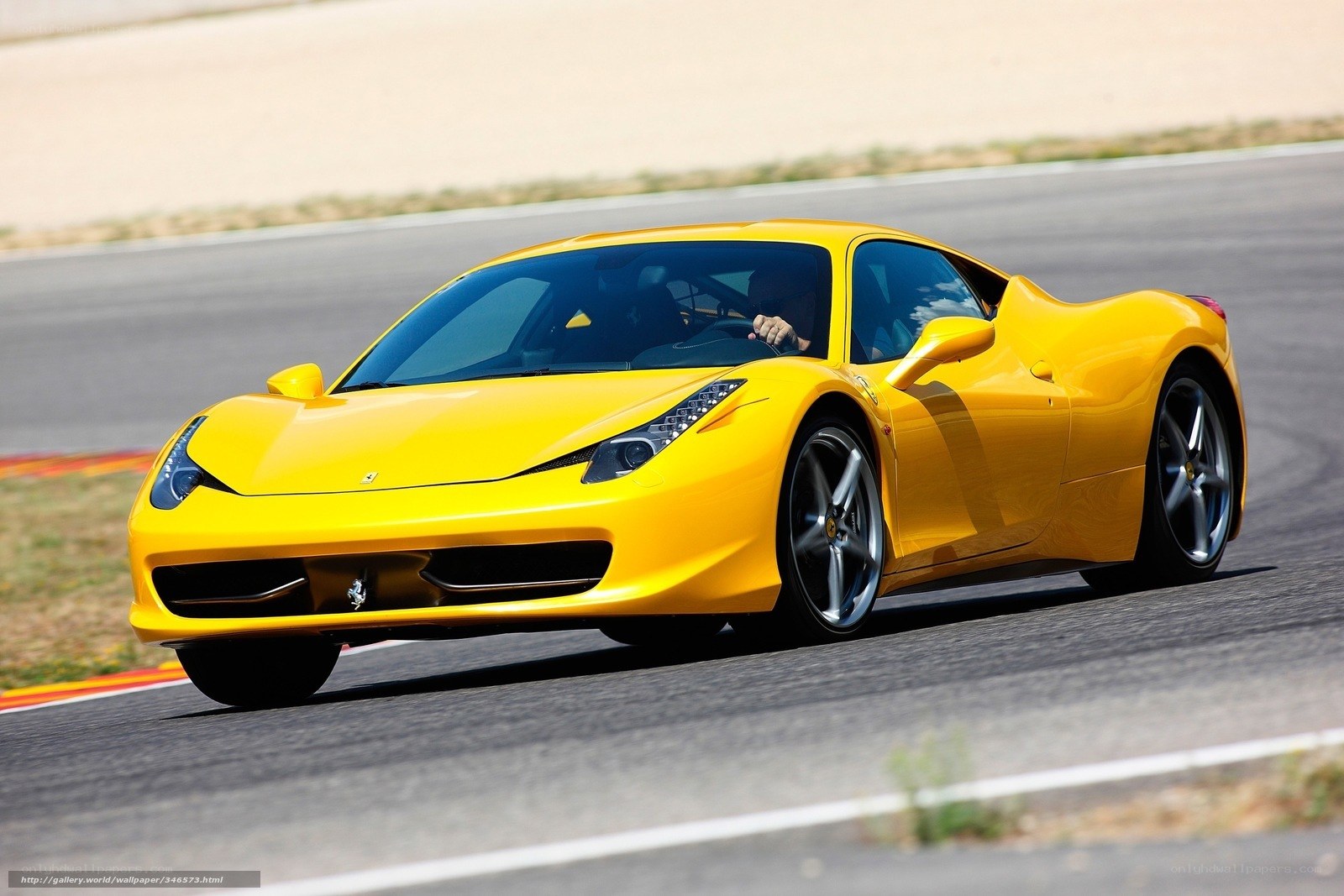 Yellow Ferrari on a racetrack