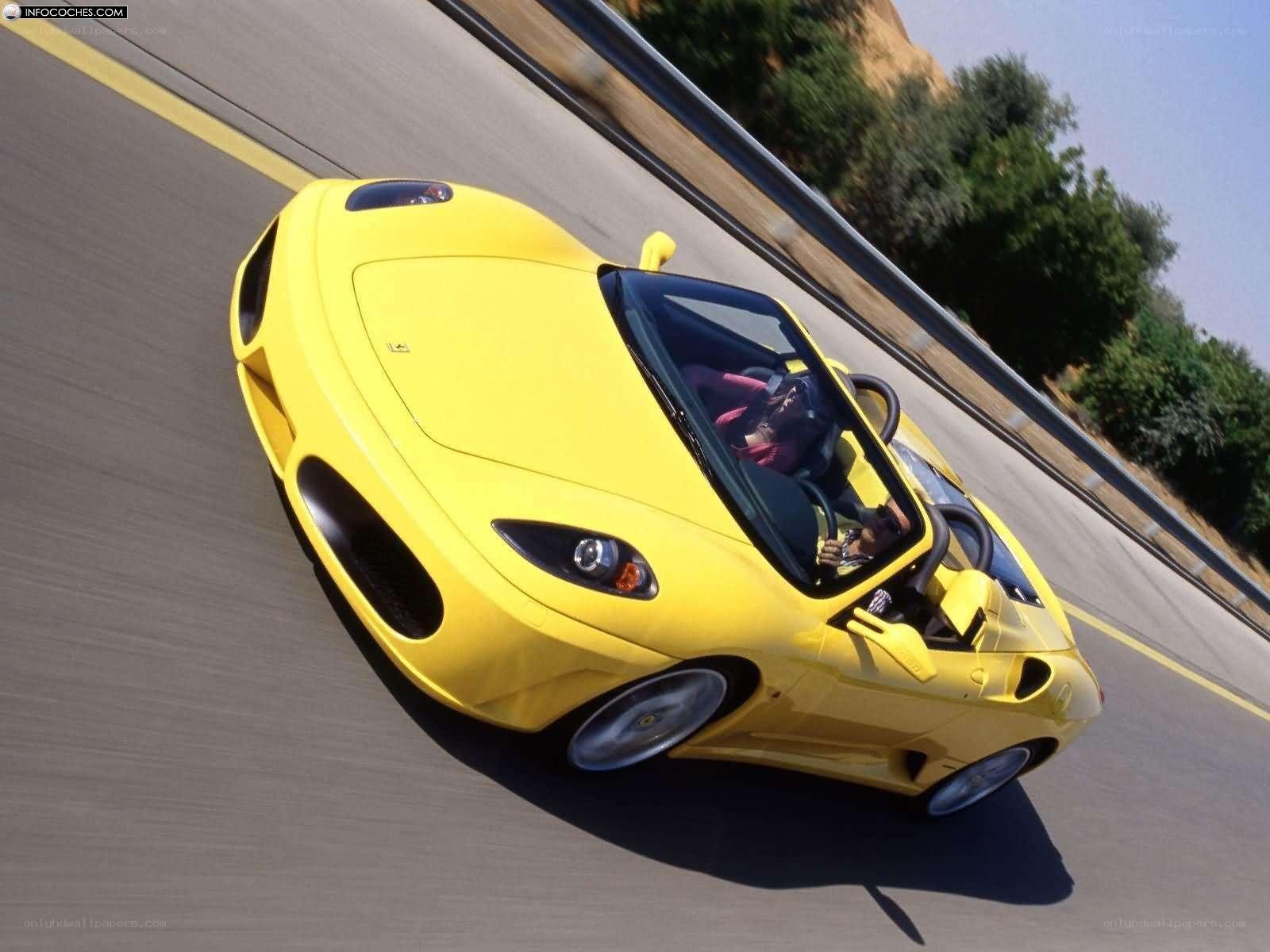 yellow ferrari on a road