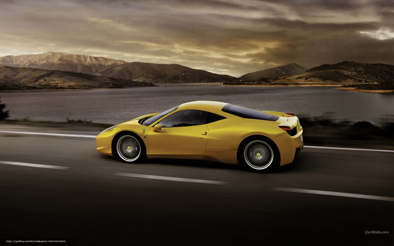 Yellow Ferrari on a scenic road