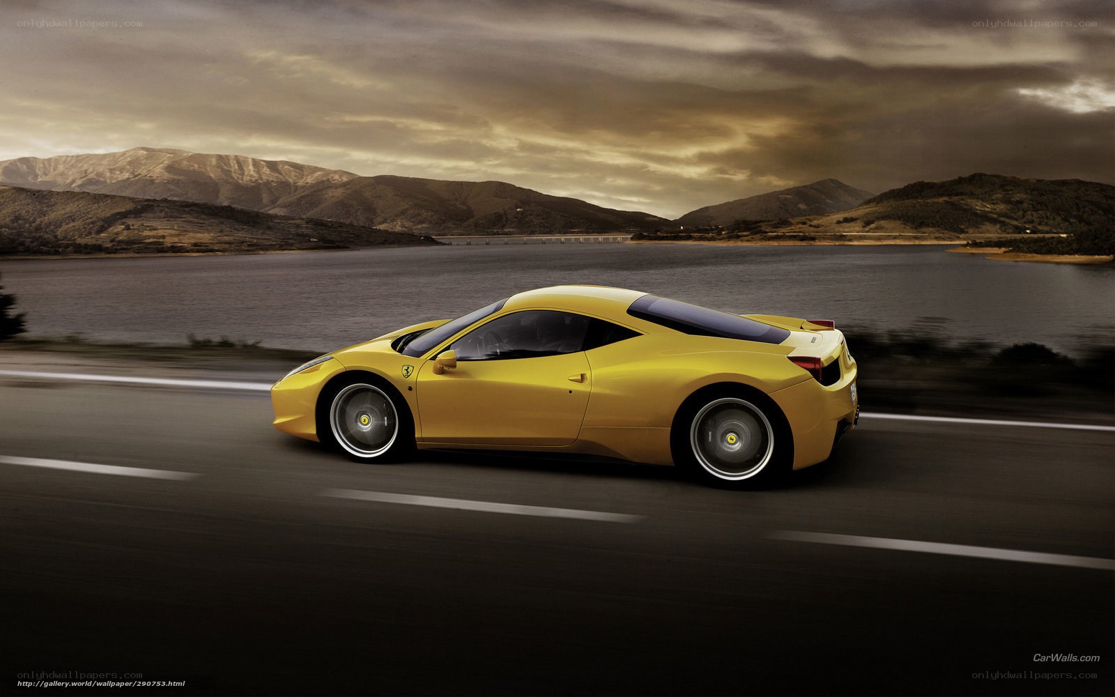 Yellow Ferrari on a scenic road