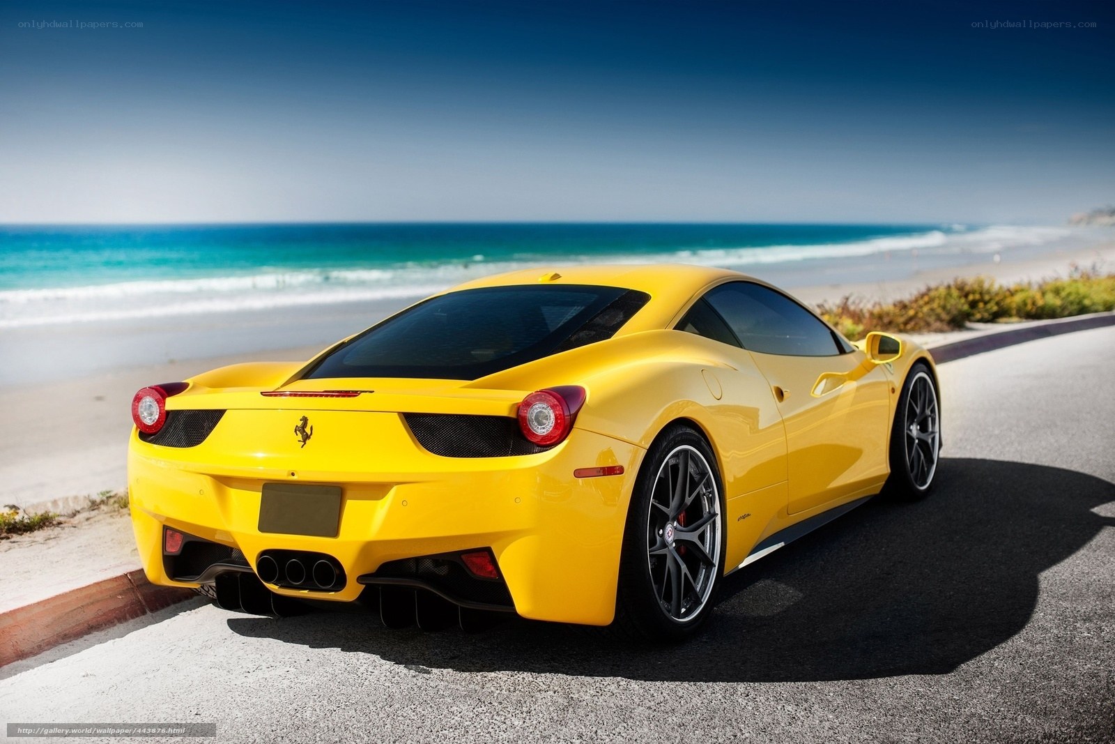 Yellow Ferrari on beach road