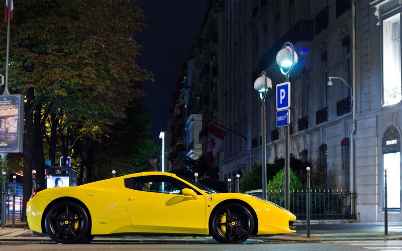 Yellow Ferrari on city street