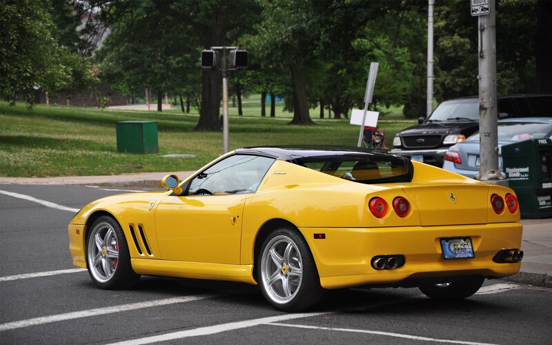yellow Ferrari on city street