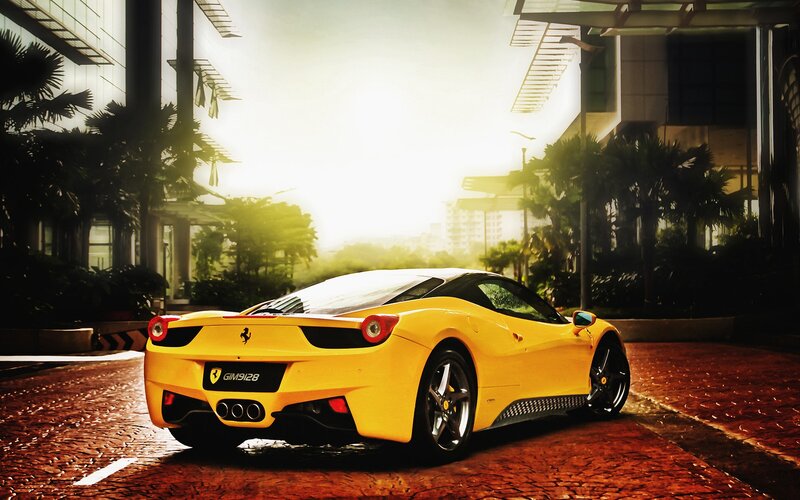 Yellow Ferrari on city street