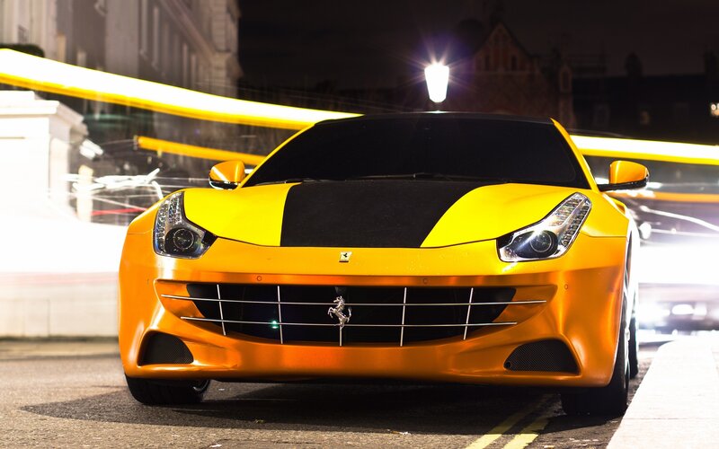 Yellow Ferrari on city street