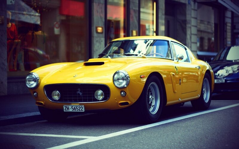 Yellow Ferrari on city street