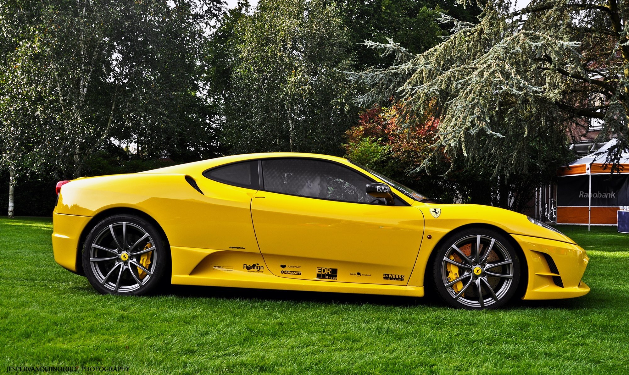 Yellow Ferrari on grass