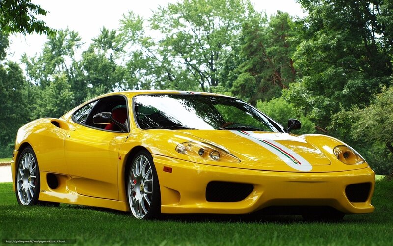 Yellow Ferrari on grass