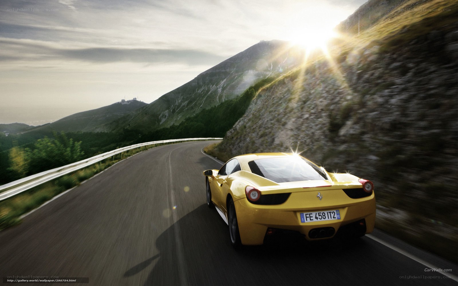 Yellow Ferrari on mountain road