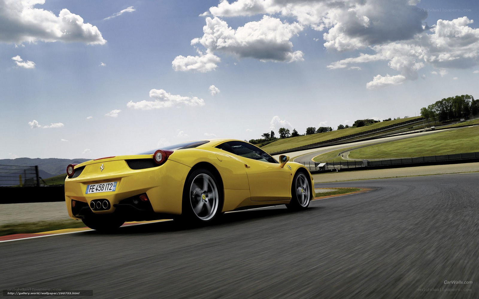 Yellow Ferrari on racetrack