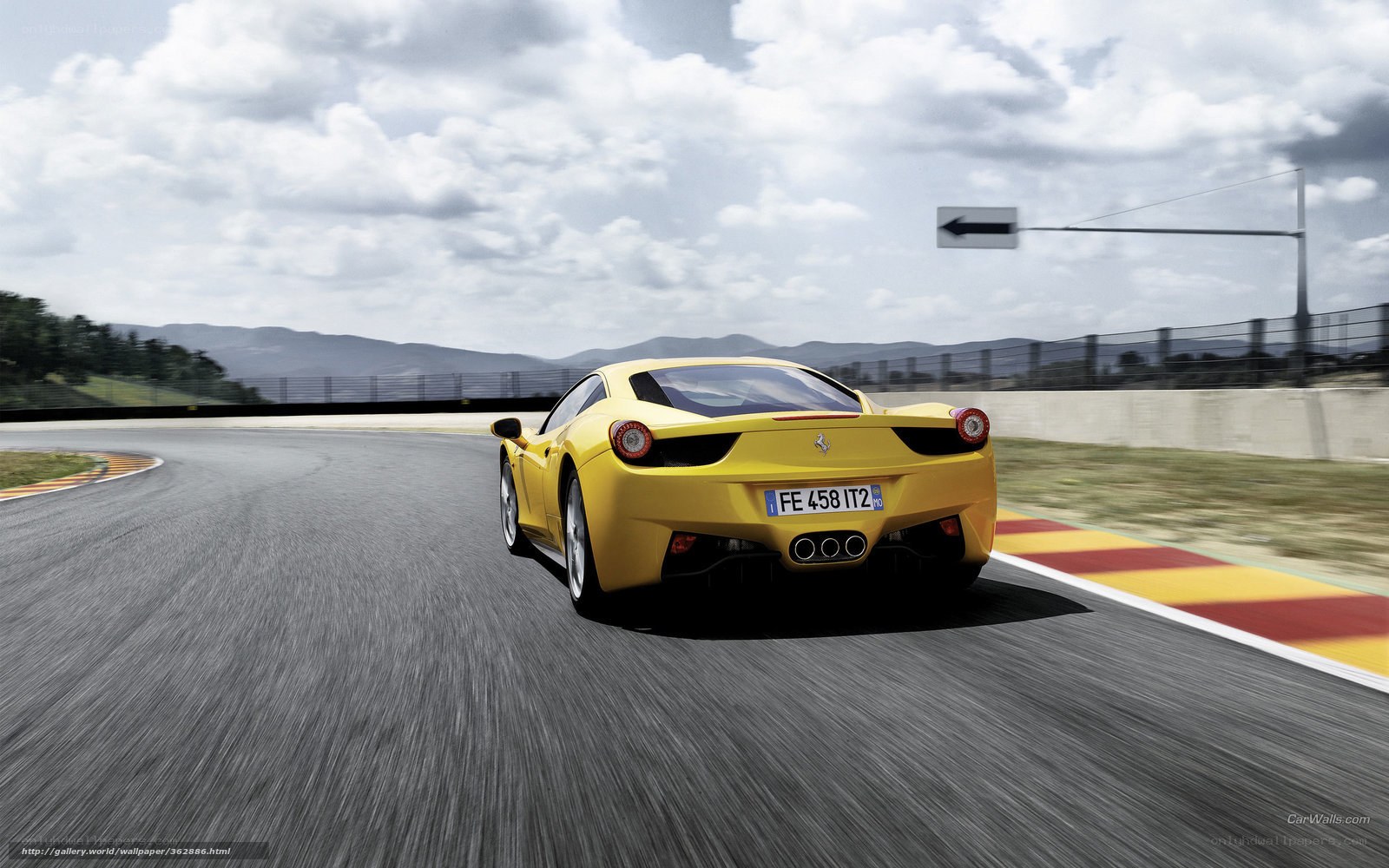 Yellow Ferrari on racetrack