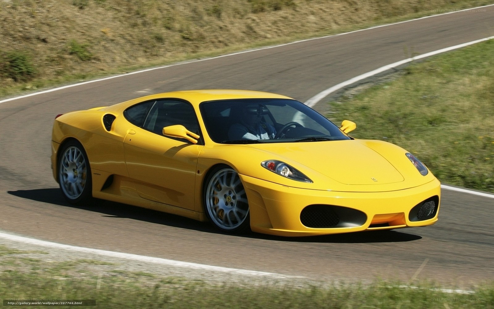 yellow ferrari on racetrack
