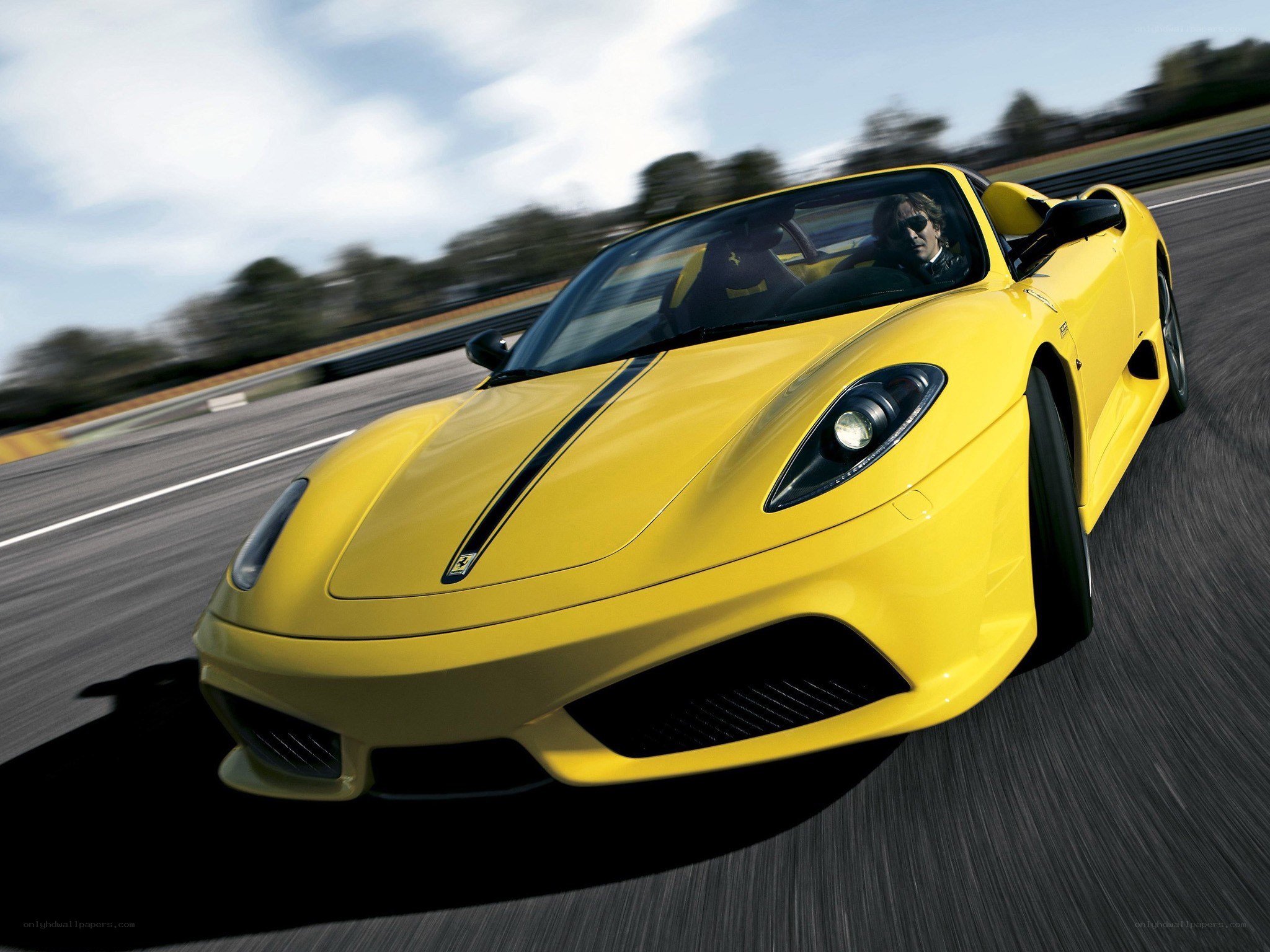 yellow ferrari on racetrack