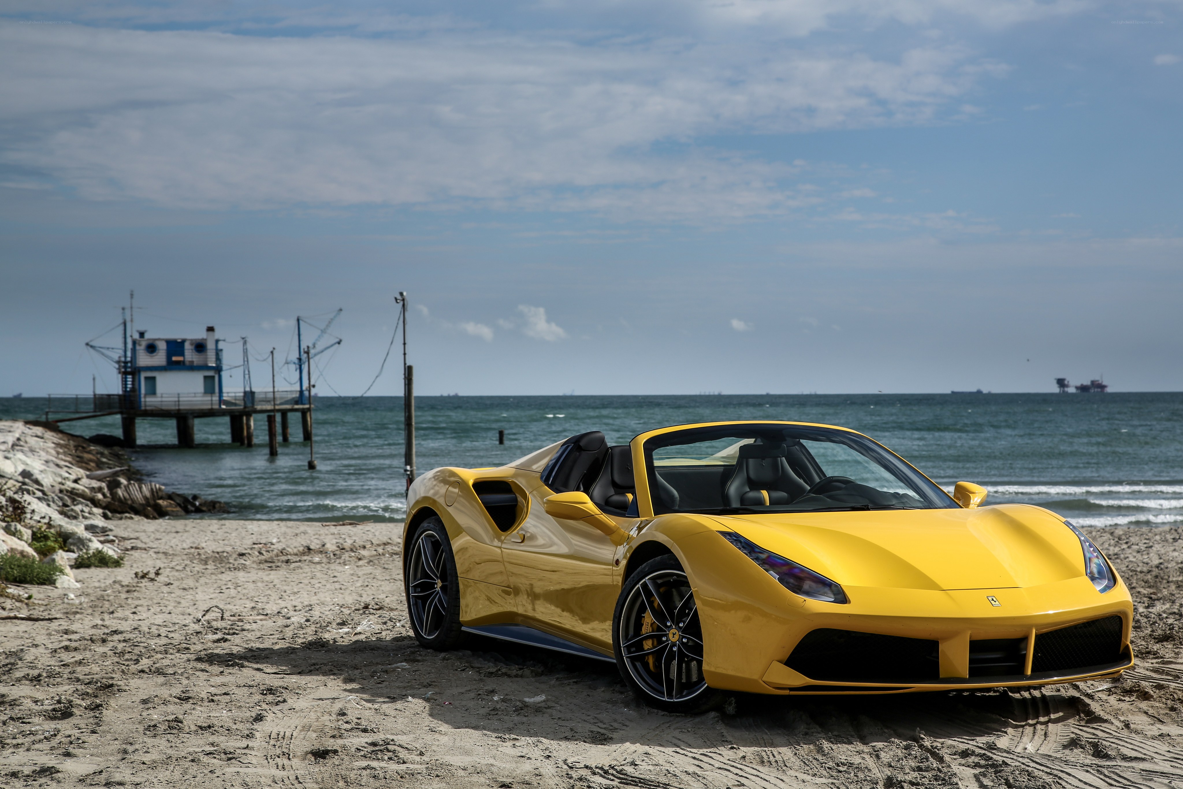 Yellow Ferrari on the beach