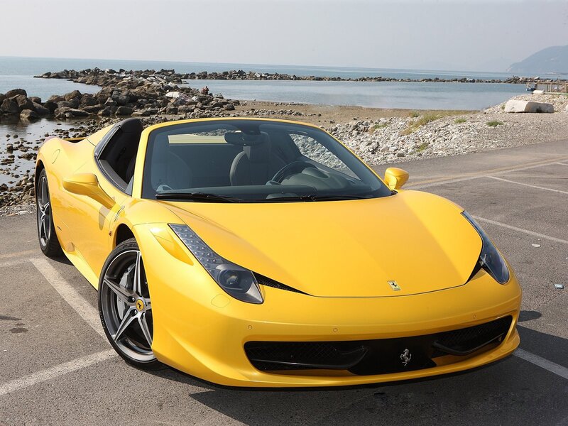 Yellow Ferrari on the coast