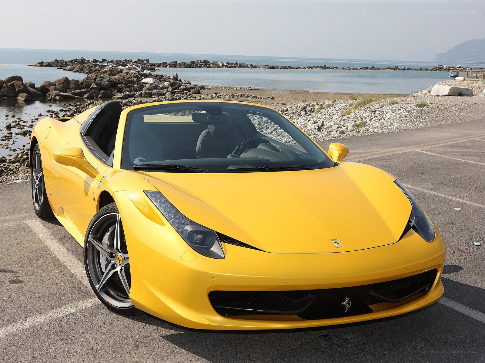 Yellow Ferrari on the coast