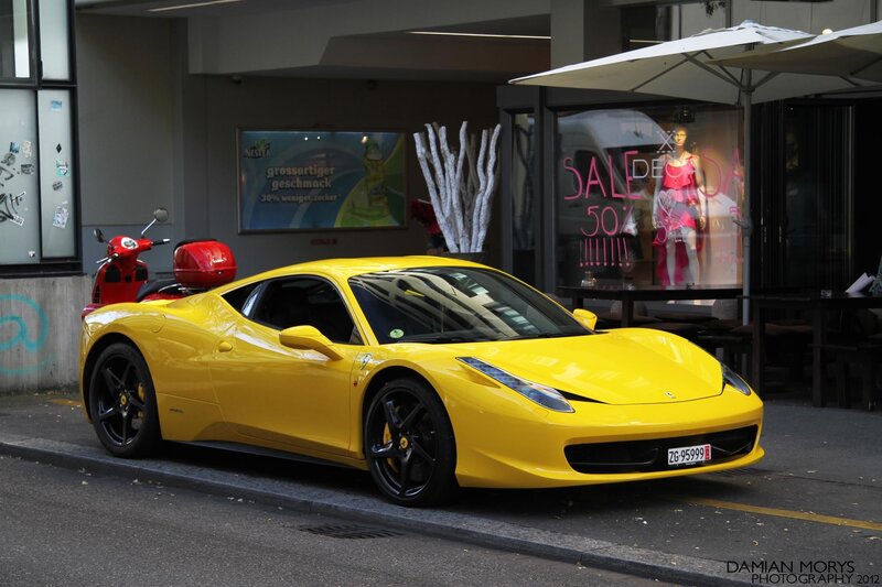 Yellow Ferrari parked on street
