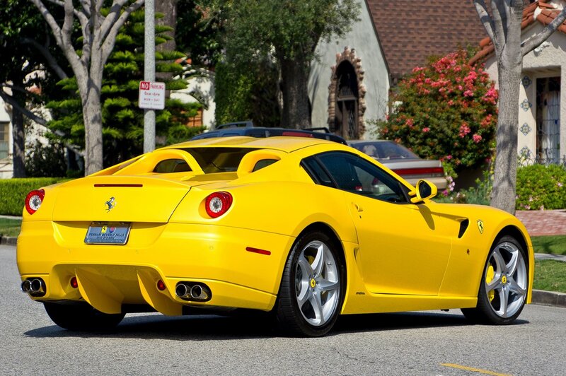 Yellow Ferrari parked on street