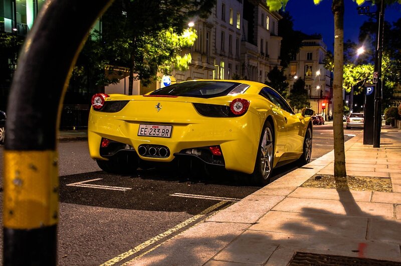 Yellow Ferrari parked on street