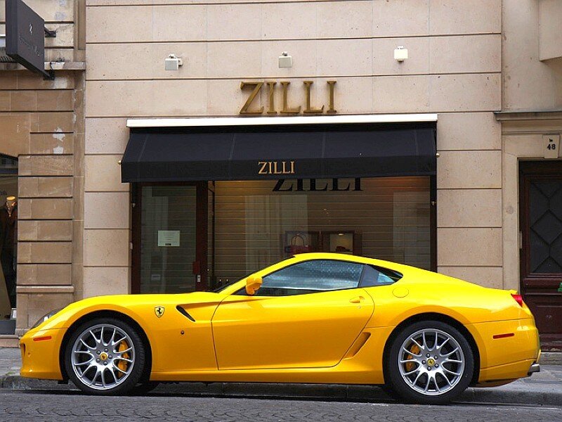Yellow Ferrari parked on street