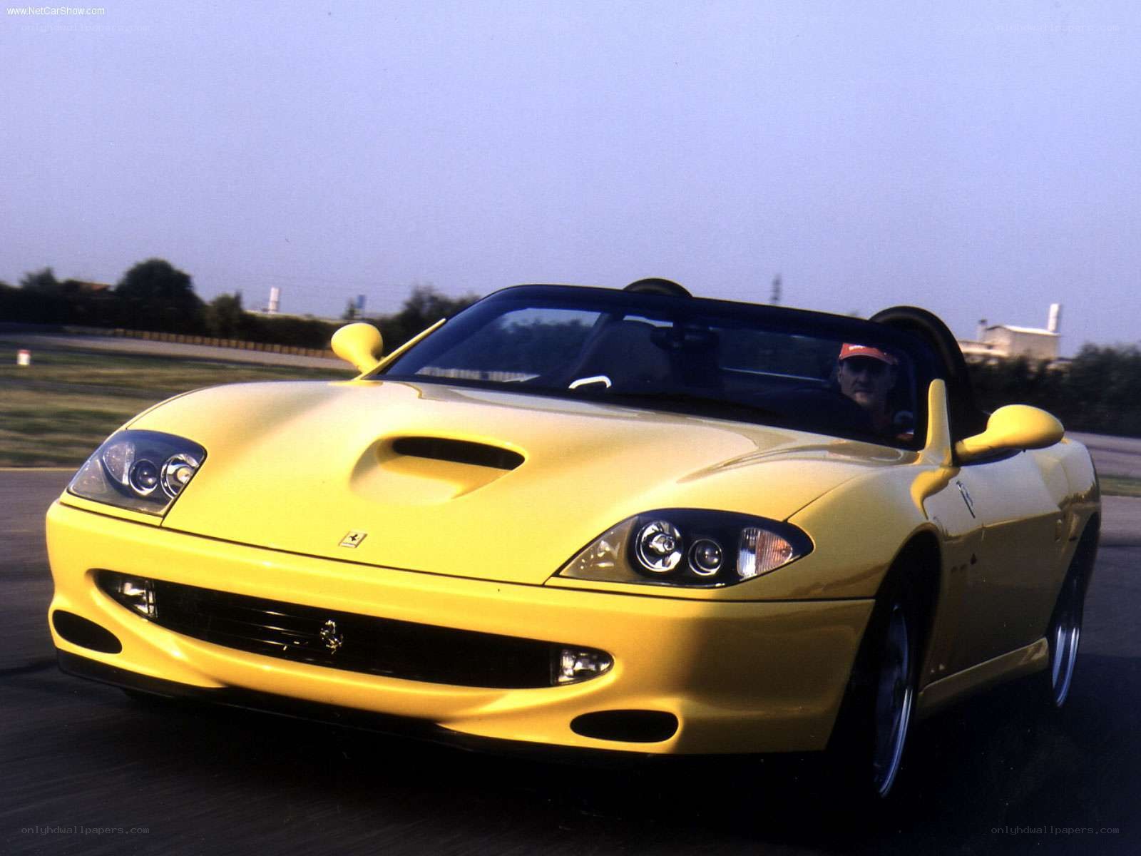 yellow ferrari roadster