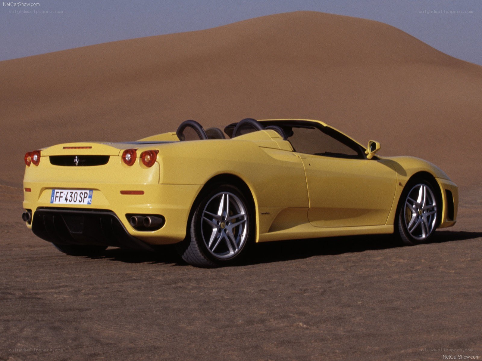 Yellow Ferrari Spider in desert