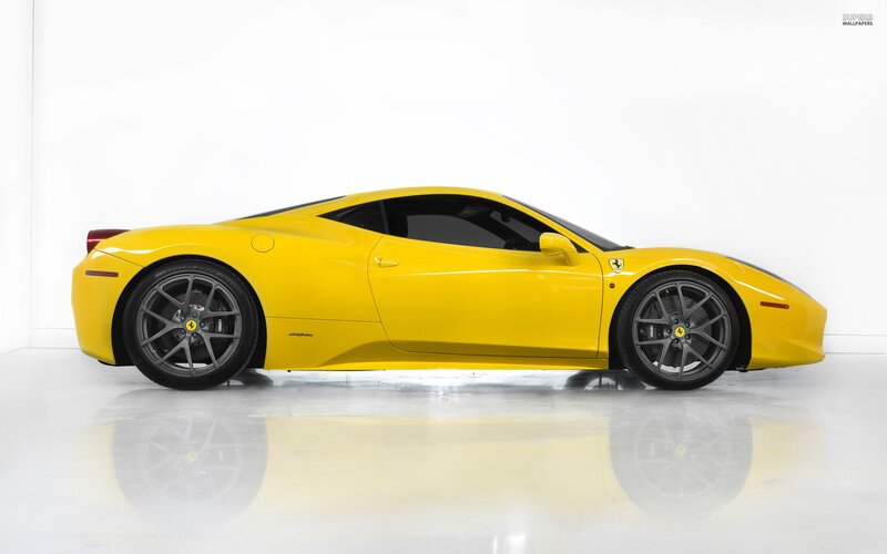 yellow ferrari sports car