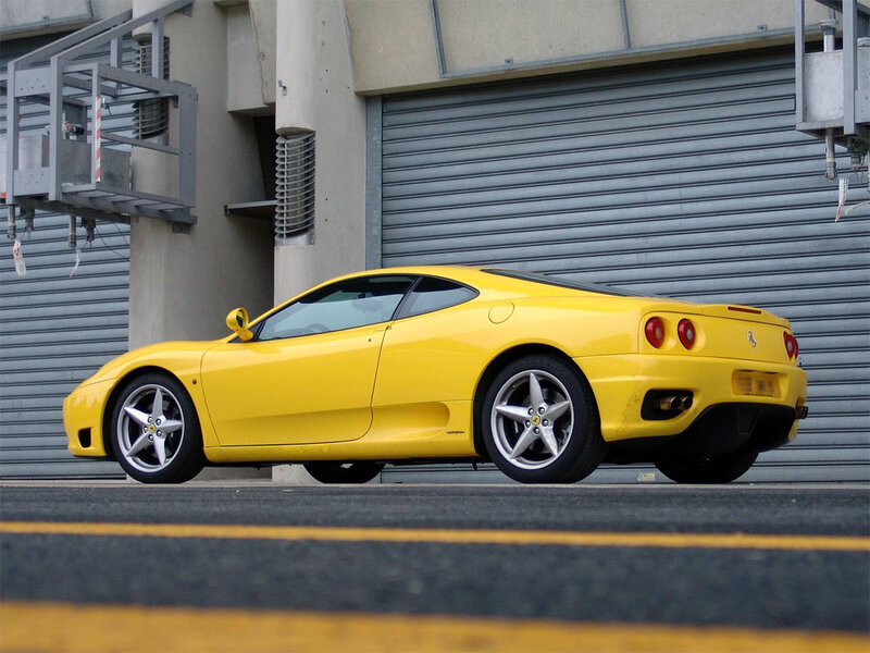 yellow ferrari sports car