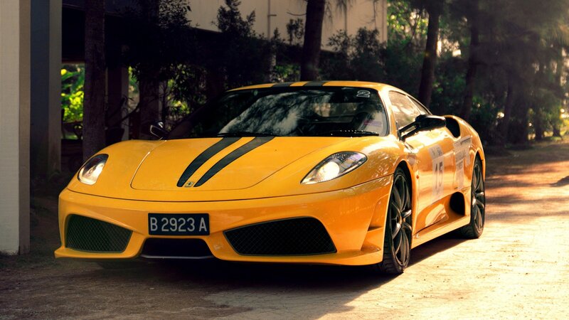 yellow ferrari sports car