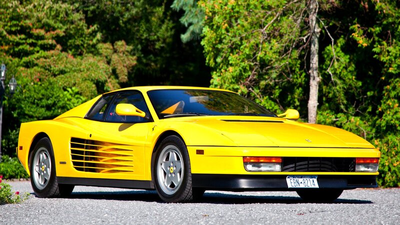 yellow ferrari sports car