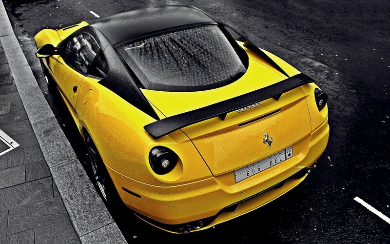 yellow ferrari sports car
