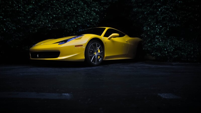yellow ferrari sports car