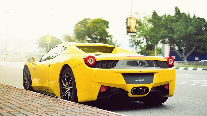 yellow ferrari sports car