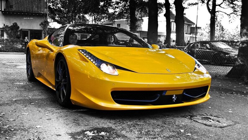 yellow ferrari sports car