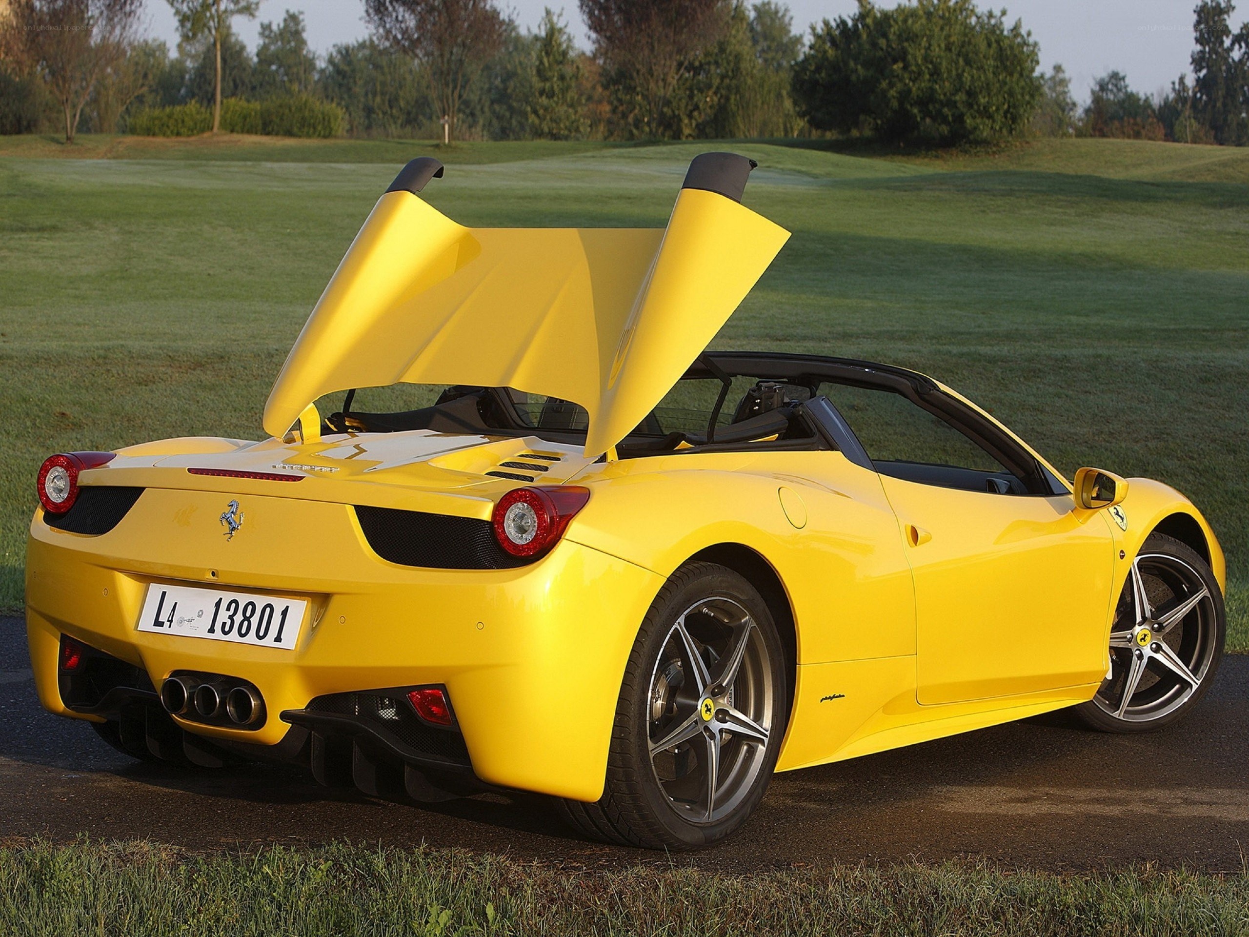 Yellow Ferrari with open doors