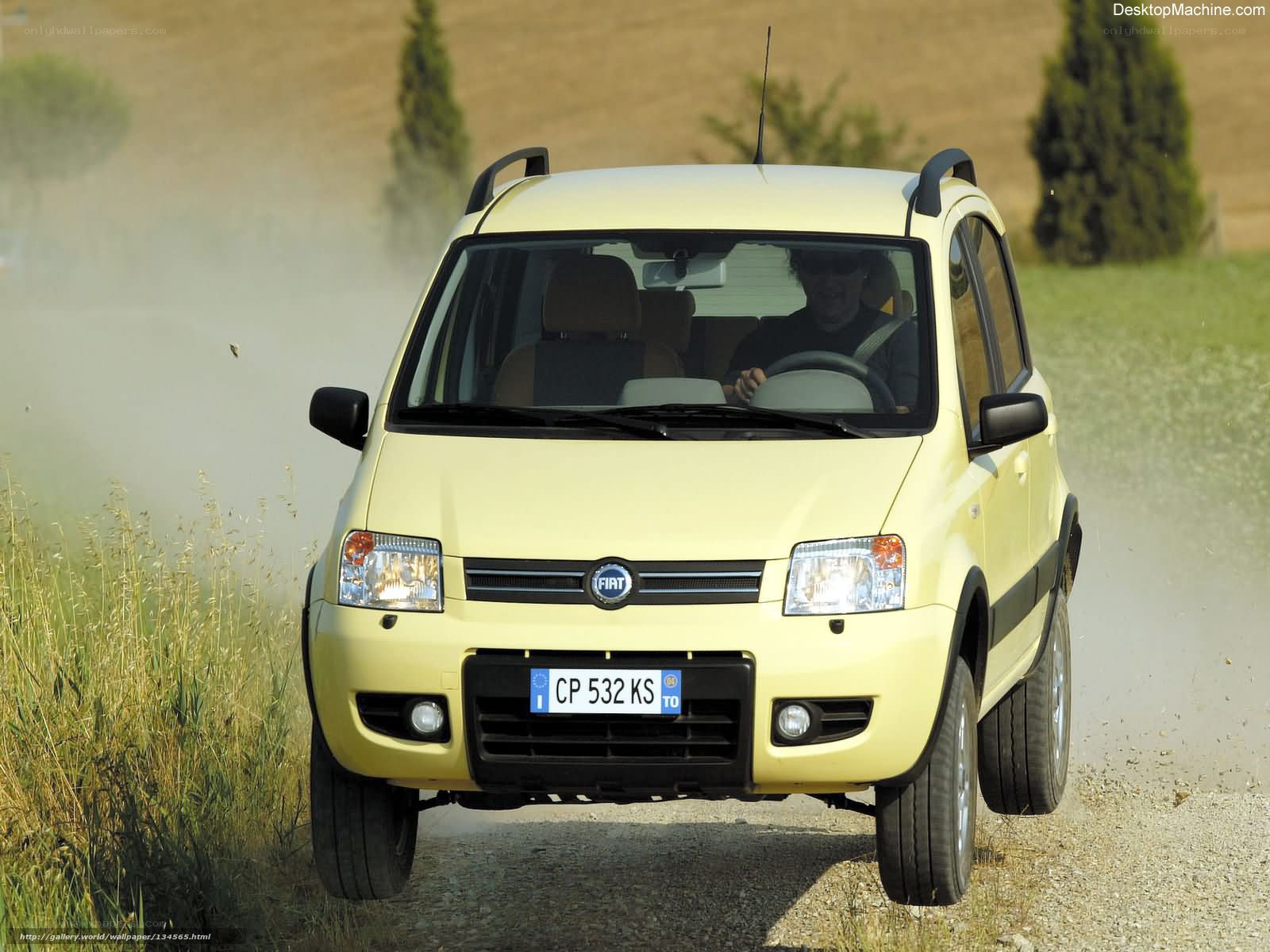 Yellow Fiat Panda on a dirt road