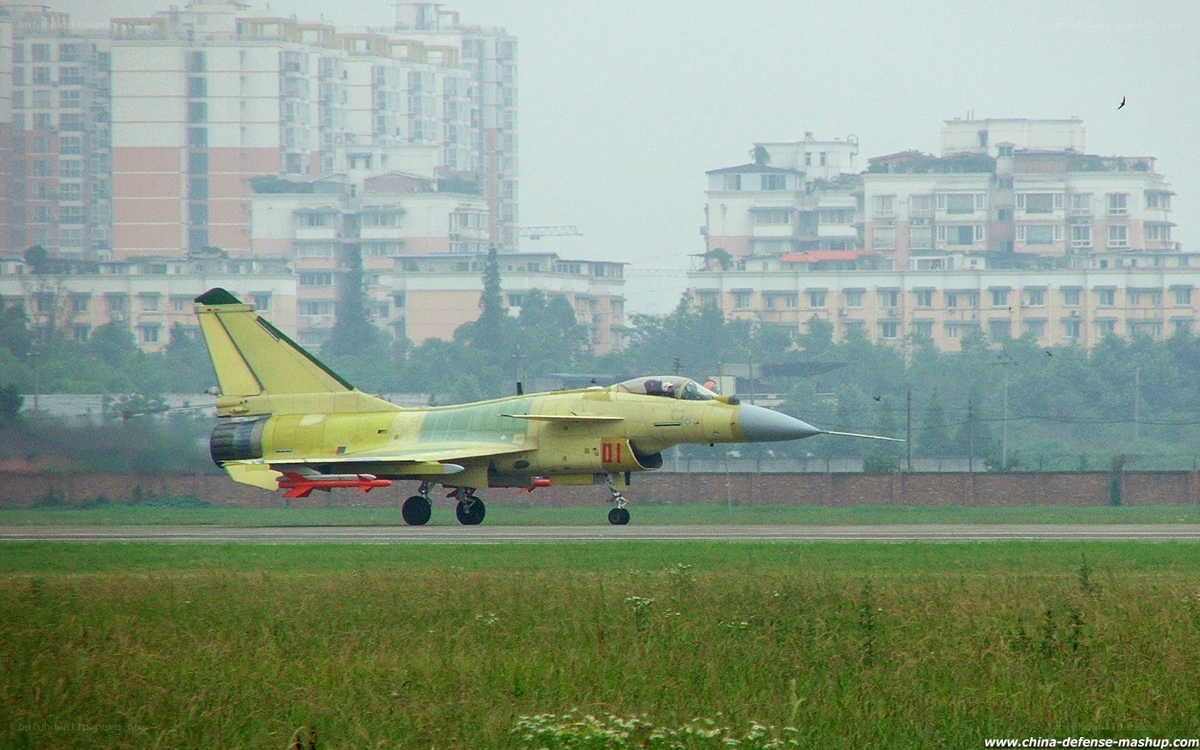 yellow fighter jet on runway