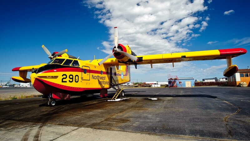 Yellow firefighting aircraft on tarmac