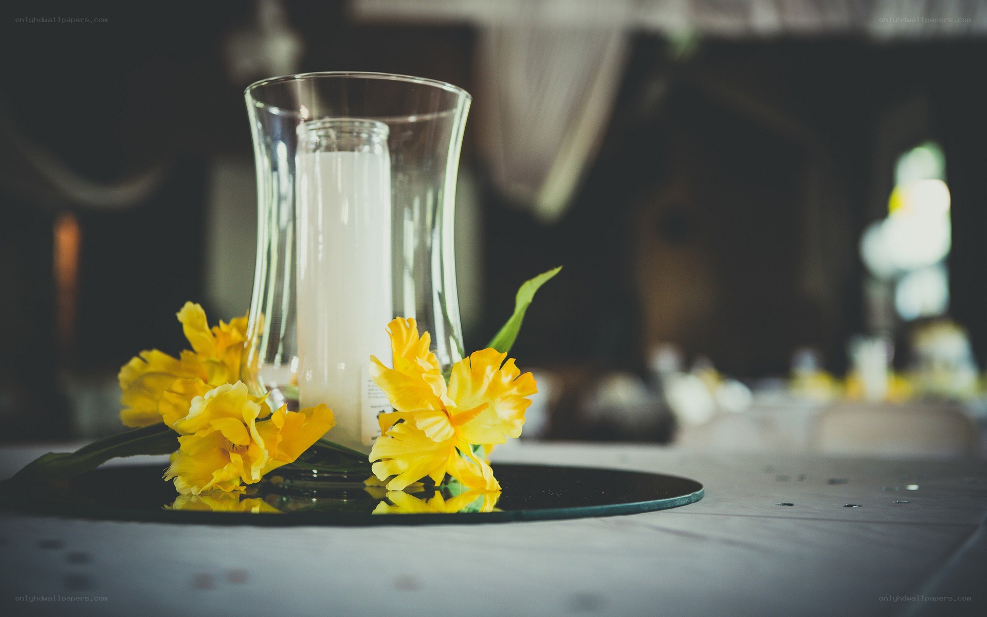 Yellow flowers and candle centerpiece