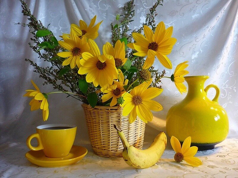Yellow flowers and coffee still life